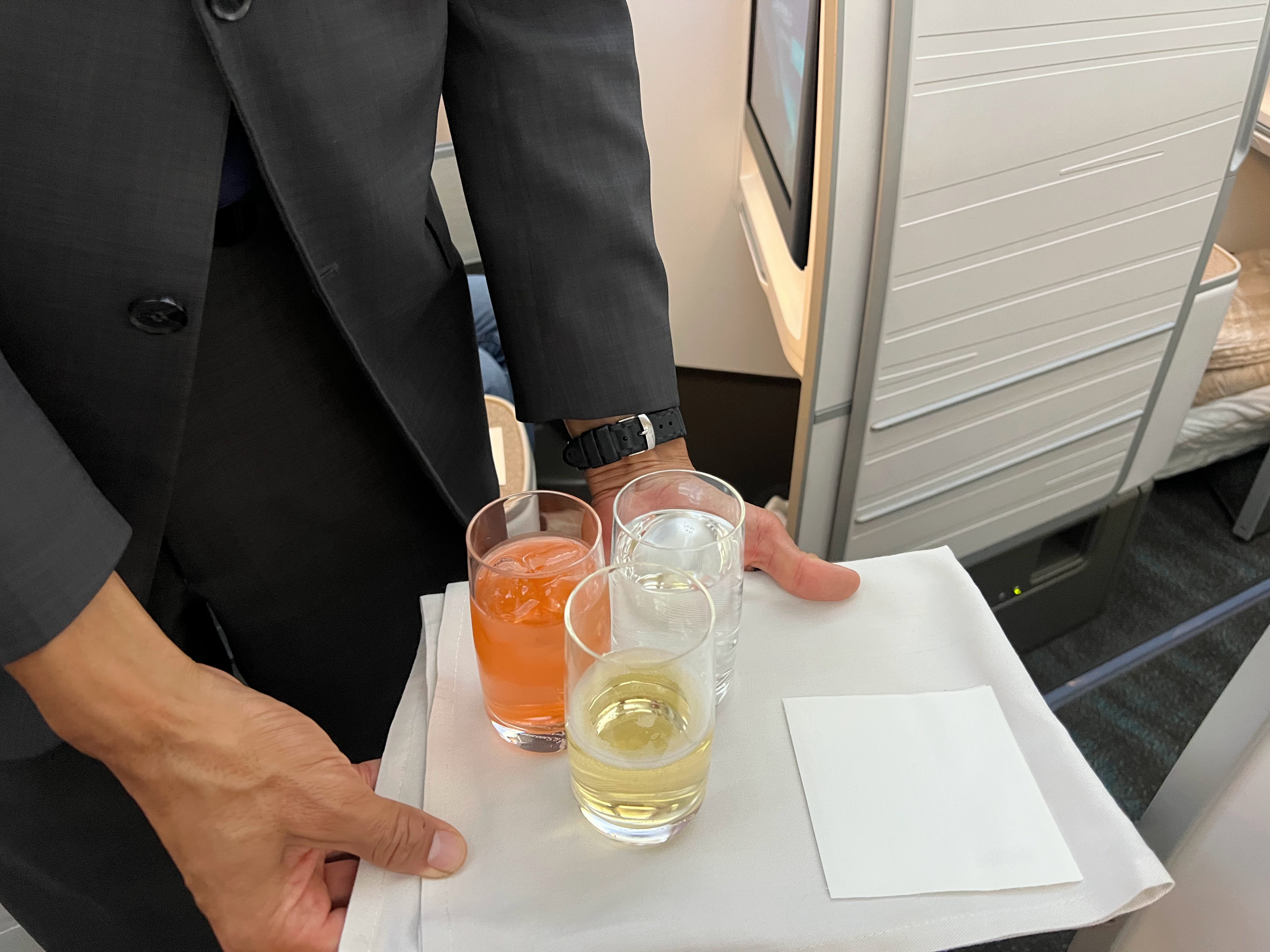 Alaska Airlines business class welcome drink service