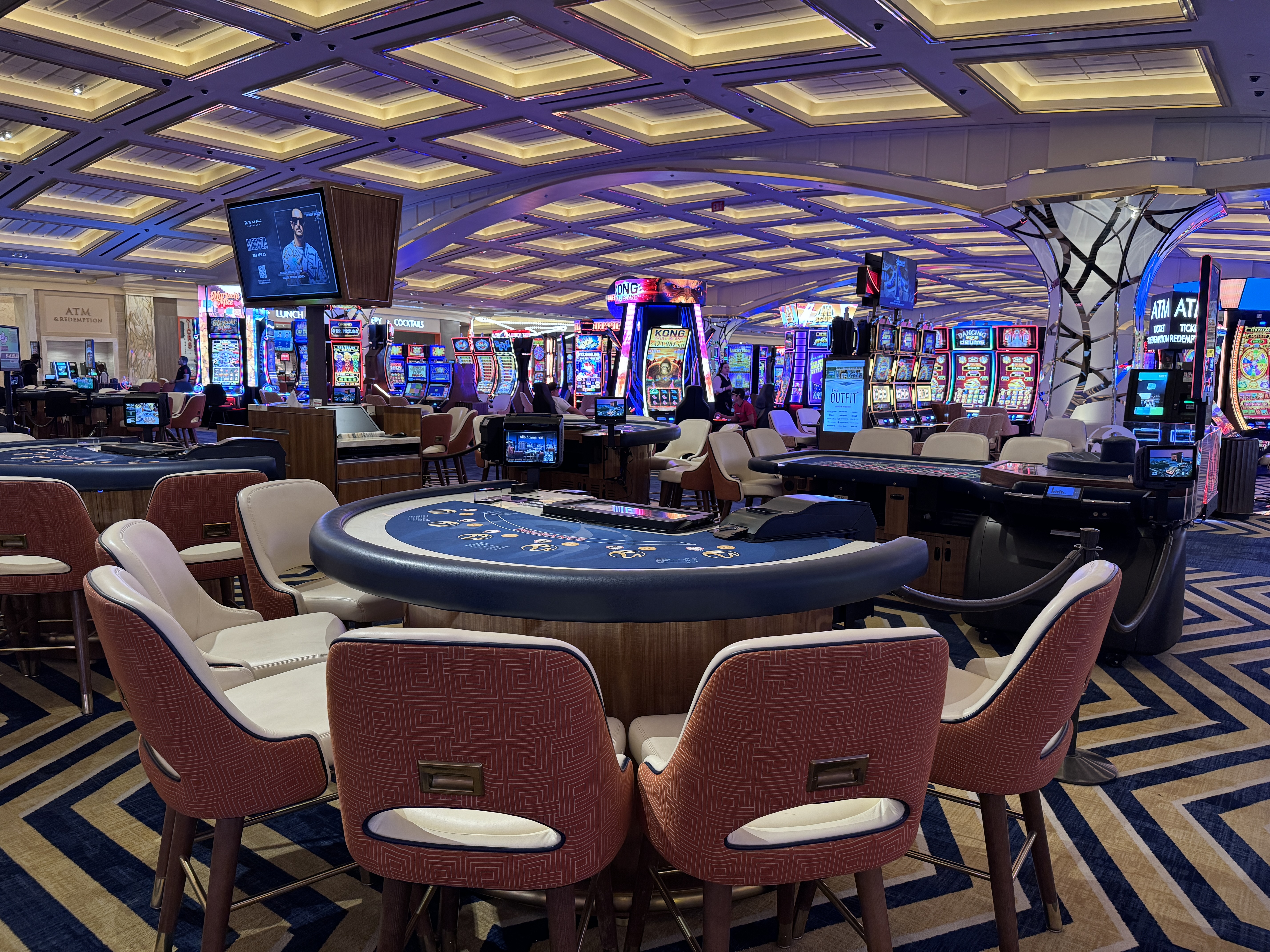 Resorts World Las Vegas casino blackjack table and slot machines