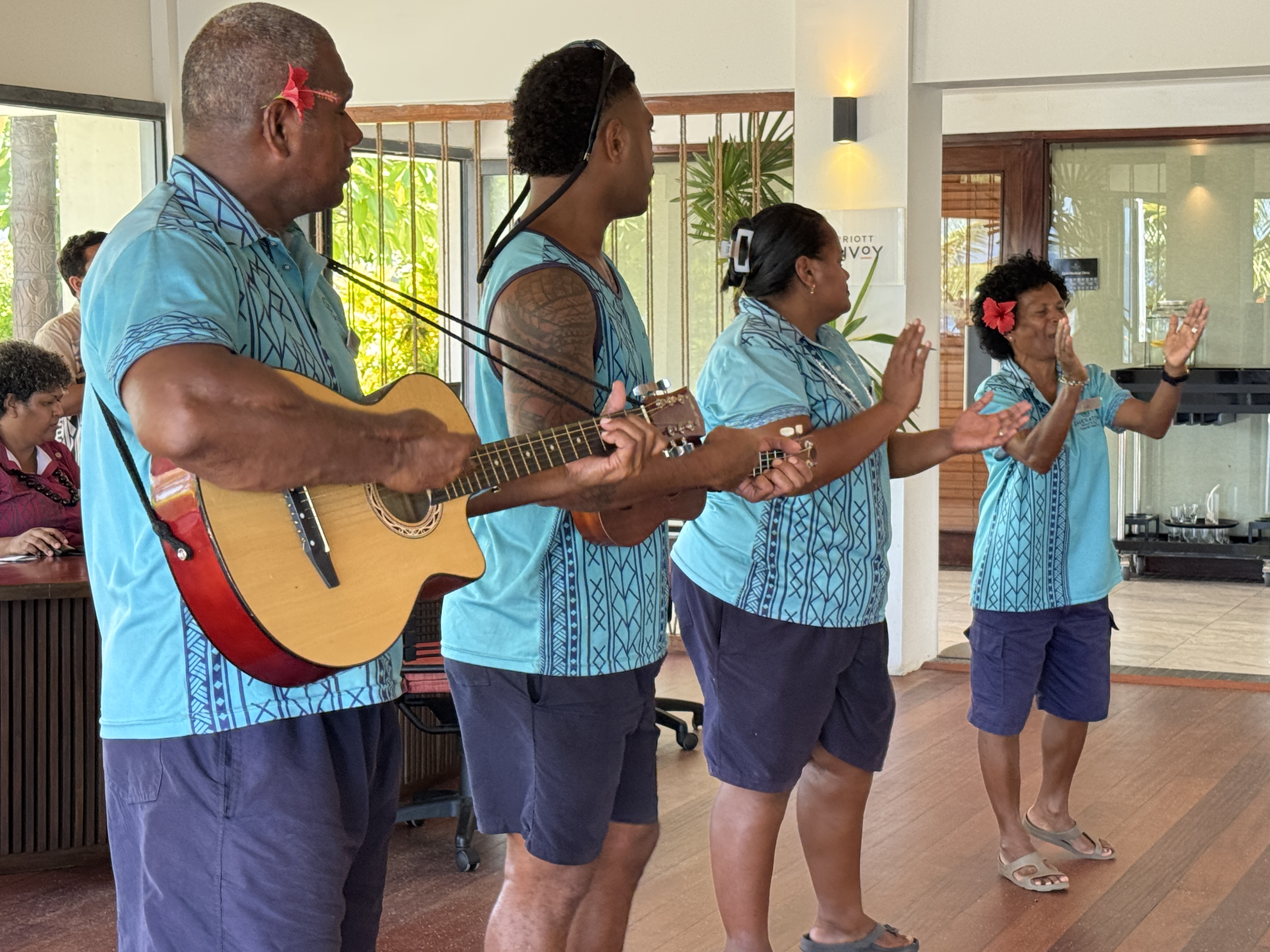 Sheraton Tokoriki Island Fijian staff performing traditional welcome song with guitar