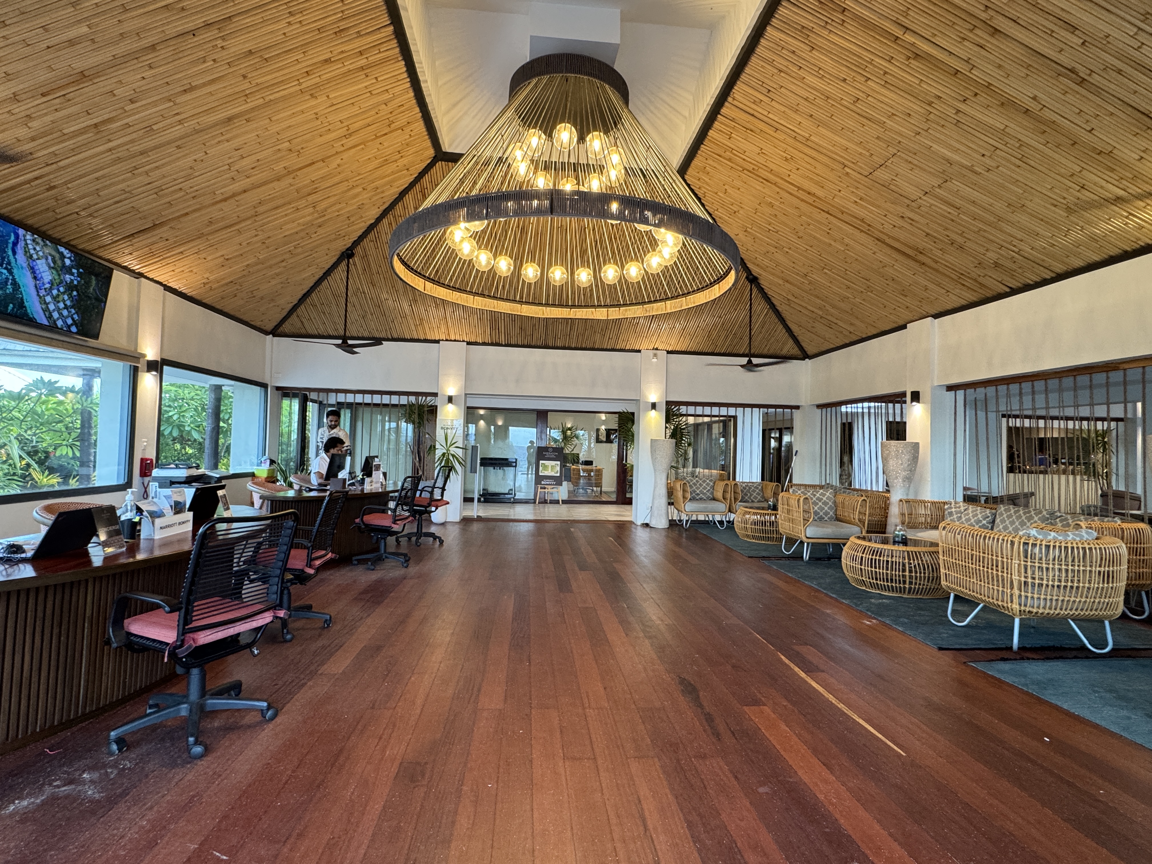Sheraton Tokoriki Island Hotel reception lobby with chandelier check in desk seating
