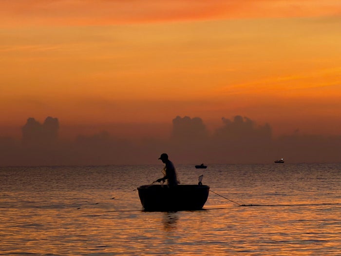 Four Seasons The Nam Hai fisherman at sunrise