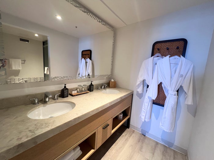 sheraton-kauai-coconut-beach-guest-bathroom-sinks-and-robes Sheraton Kauai Coconut Beach guest bathroom sinks and robes