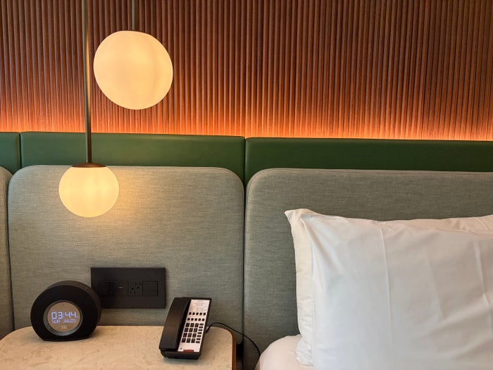 The Hyatt Centric Mag Mile bed and lamp