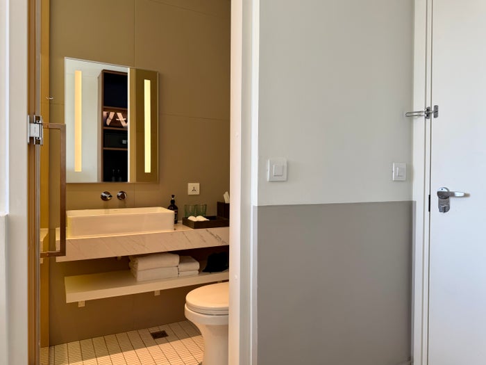 wink-danang-riverside-room-bathroom-entrance Wink Danang Riverside room bathroom entrance