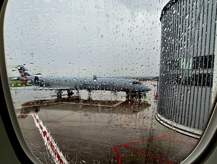 Plane at gate during weather Plane at gate during weather