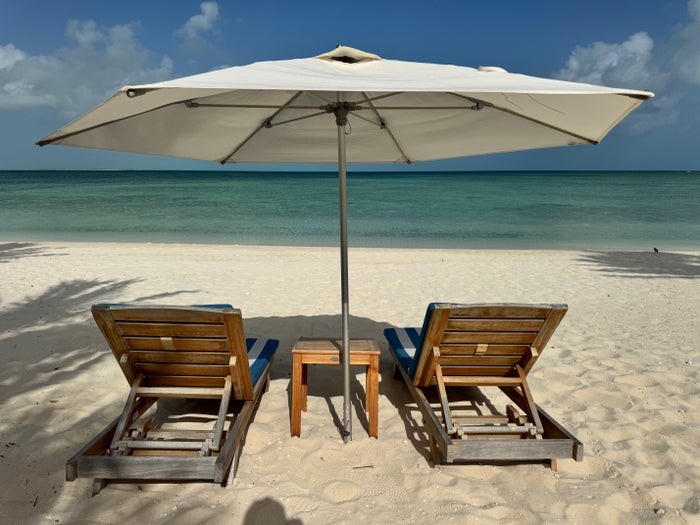 ambergris-cay-beach-chairs-and-umbrella Ambergris Cay beach chairs and umbrella